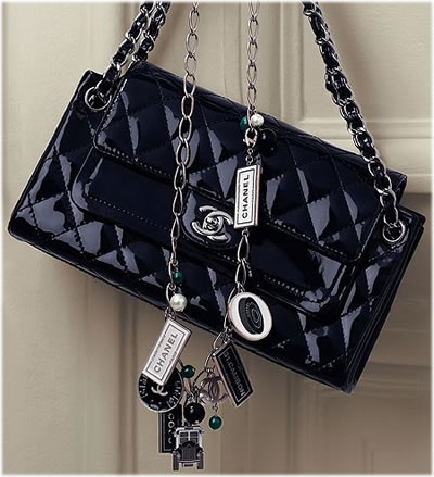 Chanel's Patent Double Flap Bag comes in a metallic dark blue shade